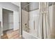 Bathroom featuring a shower and tub combo, and a walk-in closet with white shelving at 7173 S Durango Dr # 307, Las Vegas, NV 89113