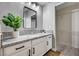 Bathroom featuring a granite countertop, a black framed mirror and a walk-in closet at 7173 S Durango Dr # 307, Las Vegas, NV 89113