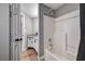 Bright bathroom showcasing a shower-tub combination with tiled surround and a vanity with granite counters at 7173 S Durango Dr # 307, Las Vegas, NV 89113
