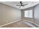 Bedroom features a ceiling fan, carpet flooring, neutral colored walls and a window to let in natural light at 7173 S Durango Dr # 307, Las Vegas, NV 89113