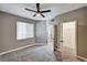 Bedroom showcasing a ceiling fan, closet and a window to let in natural light at 7173 S Durango Dr # 307, Las Vegas, NV 89113