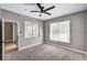 Bedroom with carpet floor and two windows offers natural light, plus access to a balcony and closet at 7173 S Durango Dr # 307, Las Vegas, NV 89113
