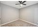 Cozy bedroom with neutral-toned walls, carpeted floor, ceiling fan, and ample electrical outlets for convenience at 7173 S Durango Dr # 307, Las Vegas, NV 89113