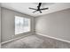 Bedroom featuring a ceiling fan, window with blinds, carpet flooring, and neutral paint at 7173 S Durango Dr # 307, Las Vegas, NV 89113