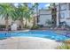 Resort-style community pool surrounded by palm trees at 7173 S Durango Dr # 307, Las Vegas, NV 89113