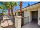 Exterior view of condo complex featuring pedestrian walkway, desert landscaping, and sunny skies in a desert climate at 7173 S Durango Dr # 307, Las Vegas, NV 89113