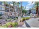 Beautifully landscaped community exterior with scenic rock feature and inviting pool area at 7173 S Durango Dr # 307, Las Vegas, NV 89113