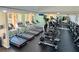 A fully equipped gym featuring rows of treadmills, stationary bikes, and large windows at 7173 S Durango Dr # 307, Las Vegas, NV 89113