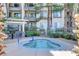 Relaxing hot tub surrounded by landscaping, trees and condos at 7173 S Durango Dr # 307, Las Vegas, NV 89113