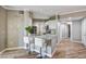 Modern kitchen featuring a peninsula with granite countertop and seating, and stainless steel appliances at 7173 S Durango Dr # 307, Las Vegas, NV 89113