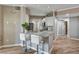 Modern kitchen featuring a peninsula with granite countertop and seating, and stainless steel appliances at 7173 S Durango Dr # 307, Las Vegas, NV 89113
