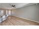 Open concept living area with hardwood floors, barstool seating at the kitchen counter, and recessed lighting at 7173 S Durango Dr # 307, Las Vegas, NV 89113
