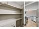 Well-organized pantry with ample shelving and storage space, located conveniently near the kitchen with stainless appliances at 7173 S Durango Dr # 307, Las Vegas, NV 89113