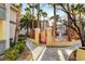Walkway to community pool area with mature landscaping and palm trees at 7173 S Durango Dr # 307, Las Vegas, NV 89113