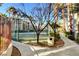 Well-maintained community tennis court bordered by palm trees and walking path at 7173 S Durango Dr # 307, Las Vegas, NV 89113