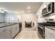 Modern kitchen with granite countertops, stainless steel appliances, and neutral tones at 7302 Sunray Point St, North Las Vegas, NV 89084