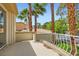 Private balcony showcases palm trees and neighborhood views, ideal for outdoor enjoyment at 8411 Carmel Ridge Ct, Las Vegas, NV 89113