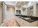 Spacious bathroom features dual sinks with granite countertops, a large mirror, and a glass shower at 8411 Carmel Ridge Ct, Las Vegas, NV 89113
