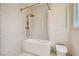 Modern bathroom featuring a standalone tub with a handheld shower and elegant tile at 8411 Carmel Ridge Ct, Las Vegas, NV 89113