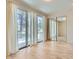 Bright bedroom with large sliding glass doors offering natural light and a mirrored closet at 8411 Carmel Ridge Ct, Las Vegas, NV 89113