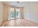 Bright bedroom with wood floors and access to balcony with views at 8411 Carmel Ridge Ct, Las Vegas, NV 89113