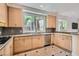 Bright kitchen with wood cabinets, granite countertops, and stainless steel appliances at 8411 Carmel Ridge Ct, Las Vegas, NV 89113