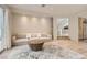 Bright living room with neutral decor, hardwood floors, and a large rug at 8411 Carmel Ridge Ct, Las Vegas, NV 89113