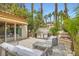 Beautiful outdoor kitchen and patio area featuring a built-in grill, seating, and landscaping at 8411 Carmel Ridge Ct, Las Vegas, NV 89113