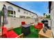 Inviting backyard with synthetic grass, stylish outdoor furniture, and a fire pit for relaxing evenings and entertaining guests at 8719 Villa Ariel Ln, Las Vegas, NV 89147