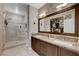 Gorgeous bathroom with large vanity, dual sinks, and walk-in glass shower at 8719 Villa Ariel Ln, Las Vegas, NV 89147