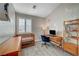 Light and bright bedroom with crib, desk and bookshelf at 8719 Villa Ariel Ln, Las Vegas, NV 89147
