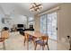 Dining area with natural light and views into the living room at 8719 Villa Ariel Ln, Las Vegas, NV 89147