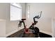 Exercise bike near the window with shutters at 8719 Villa Ariel Ln, Las Vegas, NV 89147