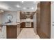 Modern kitchen featuring stainless steel appliances, granite countertops, and ample cabinet space at 8719 Villa Ariel Ln, Las Vegas, NV 89147