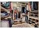 Organized walk-in closet featuring shelves, drawers, and hanging racks at 8719 Villa Ariel Ln, Las Vegas, NV 89147