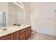 Bright bathroom features a double sink vanity and tile floor at 8805 Jeffreys St # 2073, Las Vegas, NV 89123