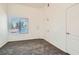 Carpeted bedroom features a bright window, closet, and white walls at 8805 Jeffreys St # 2073, Las Vegas, NV 89123