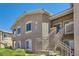 Exterior of building with stairs, multiple windows, and well-maintained green bushes at 8805 Jeffreys St # 2073, Las Vegas, NV 89123