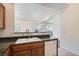 The kitchen area features tile flooring, white dishwasher, granite counters, and stainless steel faucet at 8805 Jeffreys St # 2073, Las Vegas, NV 89123
