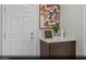 The living area features a side cabinet, a decorative plant, and elegant artwork at 9687 Biedler Ct # Lot 2, Las Vegas, NV 89178