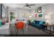 Comfortable home office with a sofa, desk, and colorful artwork at 9687 Biedler Ct # Lot 2, Las Vegas, NV 89178