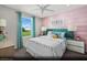 Cozy bedroom with pastel accent wall, modern furnishings, and lots of natural light at 9687 Biedler Ct # Lot 2, Las Vegas, NV 89178