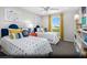 Colorful ' bedroom with two twin beds, playful decor, and ample storage at 9687 Biedler Ct # Lot 2, Las Vegas, NV 89178