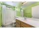 Bright bathroom features a single sink vanity and a shower-tub combo at 9753 Villa Lorena Ave, Las Vegas, NV 89147