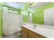 Bright bathroom features a single sink vanity and a shower-tub combo at 9753 Villa Lorena Ave, Las Vegas, NV 89147