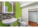 Modern bathroom features a pedestal sink and an illuminated mirror at 9753 Villa Lorena Ave, Las Vegas, NV 89147