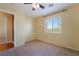Bedroom featuring neutral carpet, a ceiling fan, and a window at 9753 Villa Lorena Ave, Las Vegas, NV 89147