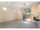 Dining area with tile flooring, sliding glass door to patio, and breakfast bar at 9753 Villa Lorena Ave, Las Vegas, NV 89147
