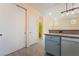 A kitchen area featuring light blue cabinets and tile flooring at 9753 Villa Lorena Ave, Las Vegas, NV 89147