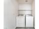 Clean, well-lit laundry room area with tile floors and ample space at 9753 Villa Lorena Ave, Las Vegas, NV 89147